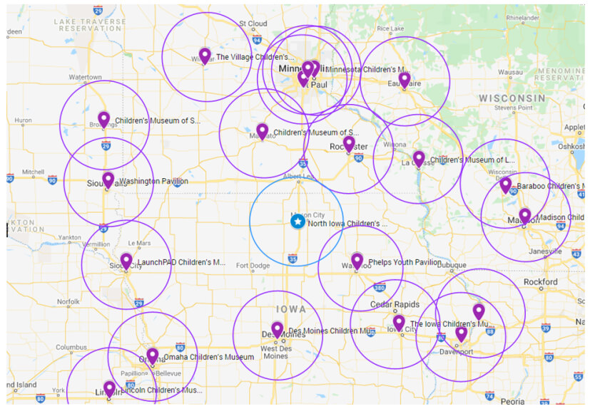 A map displaying various locations of children’s museums across the states of Minnesota and Iowa. The map features purple markers indicating the locations of the museums, surrounded by purple circles that represent the radius of each museum's reach. Major cities and landmarks are also visible in the surrounding areas.